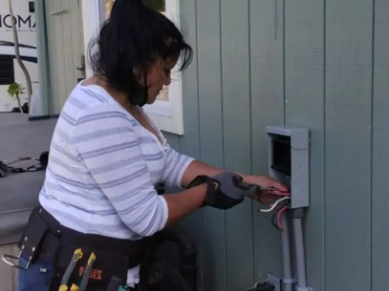 Licensed electrician wiring an exterior subpanel in Seneca